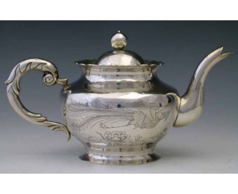 Chinese silver teapot, early 20th century, the body engraved with fenghuang and a lotus, diameter 11cm, Condition report: mar