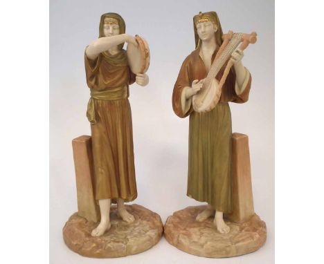 Pair of Royal Worcester figures of Egyptian Musicians  modelled playing a tambourine and a harp, green printed marks and 1912