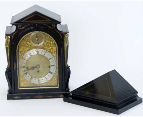 Ebony veneered bracket clock, early 20th century, the neo-classical case with Egyptian mummy caryatids and brass grille sides