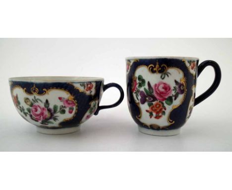 Worcester teacup and coffee cup circa 1770,   painted with flora within blue scale grounds, hatched square marks to bases, (2