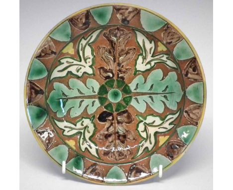 Della Robbia plate, incised with stylised leaves,   painted by Annie Jones, incised and painted marks to base, 19.5cm diamete