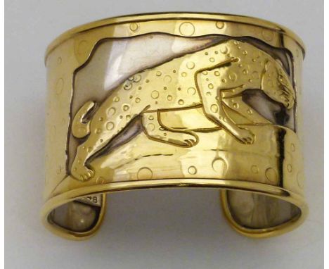 French gold and silver cuff bangle, the 18k gold outer (34.7g) cut with a panther, on a silver base, band width 42mm, 74.5g g