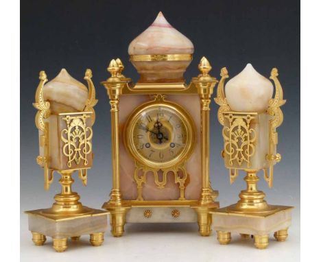 French gilt brass and marble clock garniture of Persian architectural inspiration, with a gilt arabic dial, eight day movemen