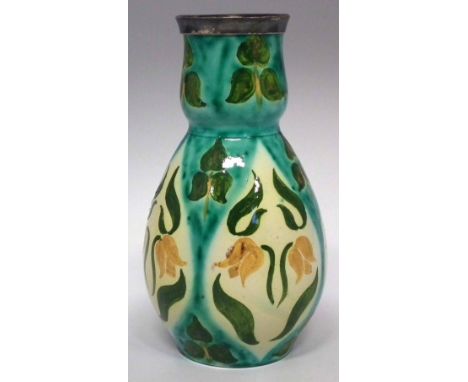 Della Robbia vase,   painted with leaves and flowers, fitted with silver plated mount, painted marks to base and 'V' artist's