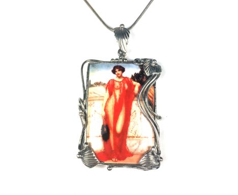 An antique enamel plaque pendant in Sterling Silver designed as a rectangular enamel placque depicting a lady in red dress, m