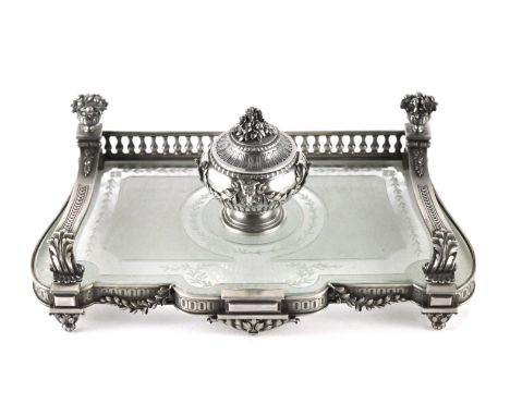 An antique late 19th Century French Silver inkstand / inkwell circa 1880. The stylised glass body with lobed and straight edg