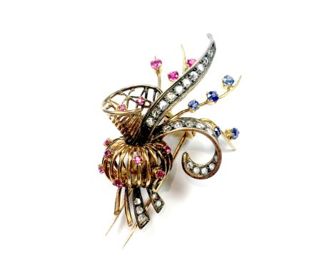 An antique jewelled diamond, ruby & sapphire floral spray brooch in 18ct yellow gold circa 1940 designed as a floral spray se