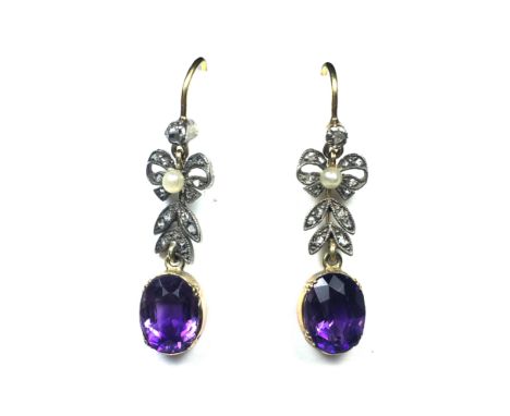 A pair of antique 19th Century amethyst, pearl and diamond earrings in yellow gold and silver each set with an oval cut ameth