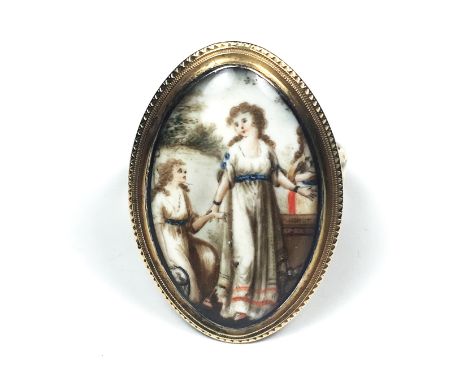 An antique late Georgian portrait miniature ring in high carat yellow gold designed as a navette shaped portrait miniature de