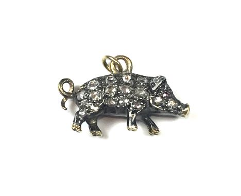 An diamond pig / piglet pendant or charm in gold, set modeled as a a pig with curly tail, set all over on both sides with ros