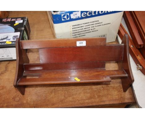 A mahogany extending book trough