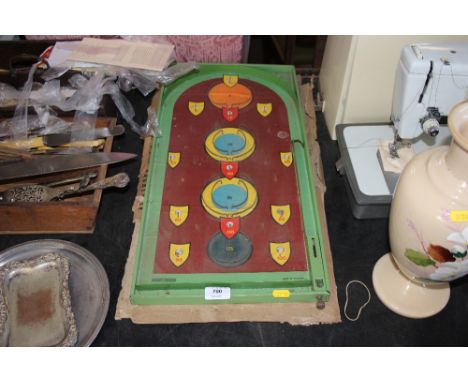A bagatelle board with box