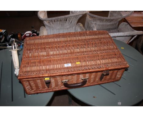 A wicker picnic hamper and contents 