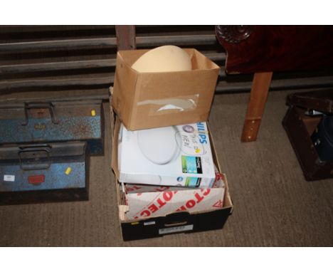 A box containing wall lights; LED ceiling light; wire cutters etc. 