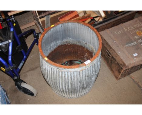 A galvanised planter; together with a garden light in the form of a bird