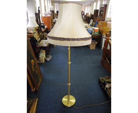 Tall brass standing lamp shade.