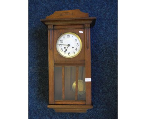 A Mahogany cased wall mounting clock.