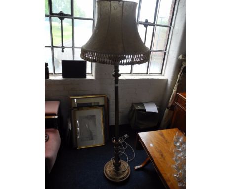 Gold painted standard lamp with shade.