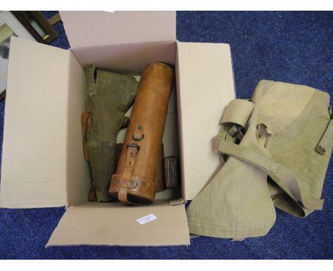 Box containing tripod, light meter, rucksack, and a telescope.