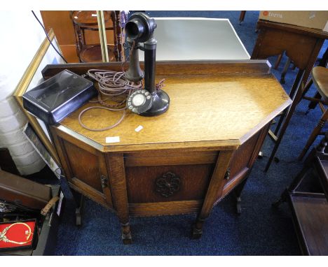 Oak telephone table with chair and stick phone.