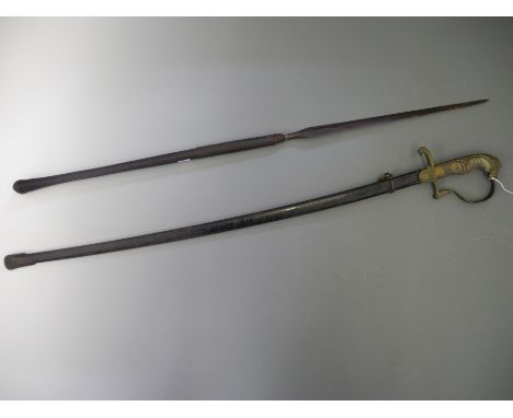 An early 20th Century officers dress sword with decorated blade with brass hilt and lion design pommel, with scabbard, blade 