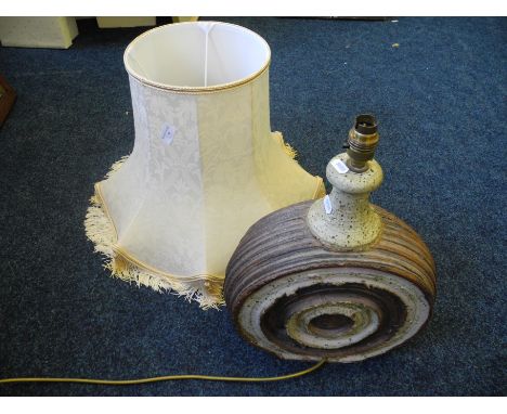 A studio pottery table lamp with shade.