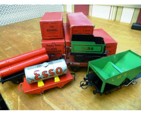 5 BOXED HORNBY 0 GAUGE - M1 TENDER, GAS CYLINDER WAGON, MO PETROL TANK WAGON, FLAT TRUCK AND HOPPER WAGON