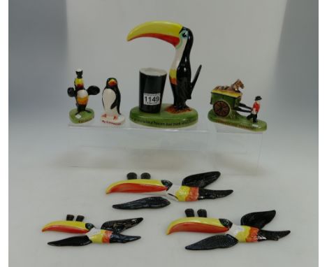A collection of Carltonware Guiness advertising figures to include lamp bases, ornamental figures and wall plaques (7)