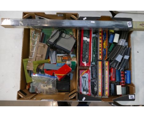 A good collection of Hornby trains, track, and accessories to include boxed Evening Star engine, ESSO petroleum carriages etc