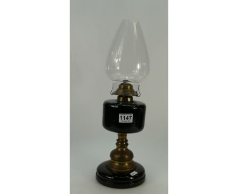 Heavy glass and brass undecorated oil lamp with bell shaped shade