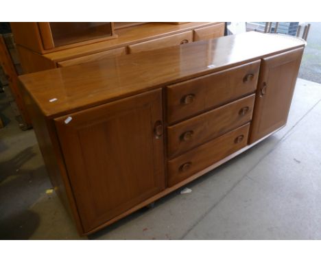 Mid Century Ercol light oak sideboard with 3 drawer centre 
