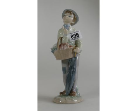 Lladro tall figure of a Boy with an Umbrella and a basket of fruit 