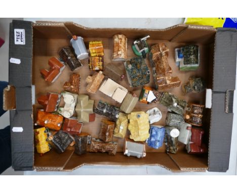 A mixed collection of novelty ceramic items to include house, pubs, windmills etc