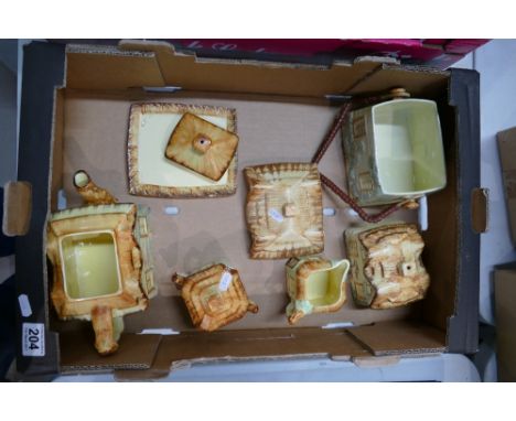 A collection of Farmhouse ceramic decorative cottage style items to include biscuit barrel, teapot, milk, cream etc 