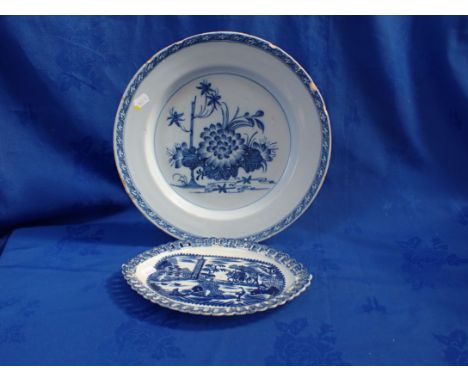 A DELFTWARE CHARGER DECORATED WITH FLOWERS 34cm diam. (damage) and a Pearlware plate, transfer printed, with open border (2)