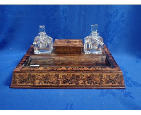 A 19TH CENTURY TUNBRIDGE WARE DESK STAND with central lidded box and flanking inkwell (some damage)