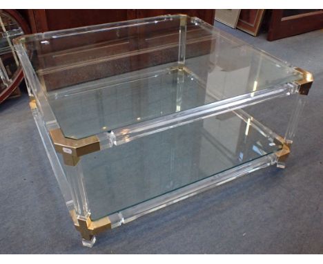 A 1980s POST-MODERN STYLE PERSPEX FRAMED COFFEE TABLE with glass top and undershelf, with canted corners