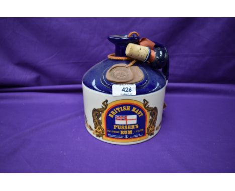 A Ceramic Decanter of British Navy Pussers Rum, with stopper, British Virgin Islands. 1 litre, 95.5 proof.
CONDITION REPORT
L
