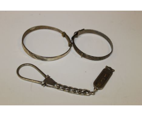 A HALLMARKED SILVER BUCKLE BANGLE - BIRMINGHAM 1986, together with a gilt metal bracelet stamped 925, and an Egyptian silver 