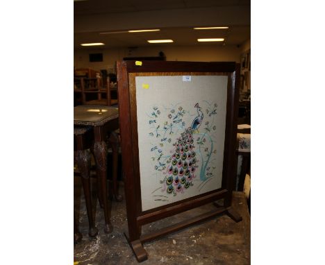 AN OAK GLAZED FIRESCREEN
