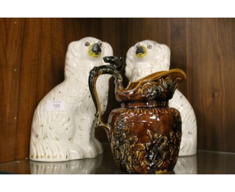 A PAIR OF STAFFORDSHIRE STYLE SPANIELS + AN ARTHUR WOOD TREACLE GLAZE HUNTING JUG