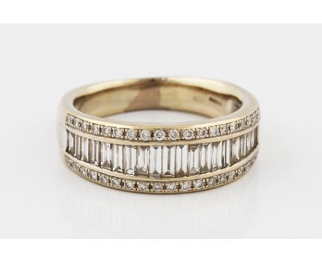 A Mappin & Webb 18ct white gold diamond half eternity ring, set with a central row of graduated baguette cut diamonds, flanke