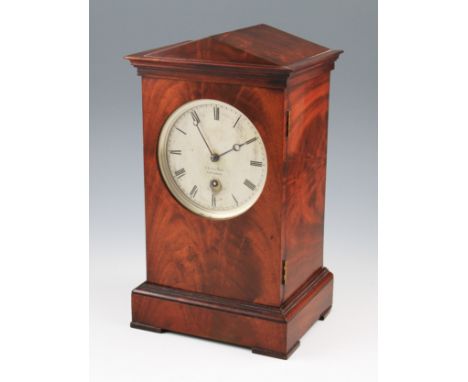 A 19th Century mantel clock by Benjamin Vulliamy, the flame mahogany case in architectural design with tapered top with stepp