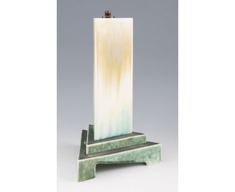 A Ruskin pottery crystalline lamp base of triangular form with beige, cream and blue colouring on matt green glazed stepped b