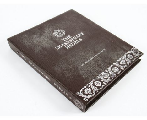 'The Shakespeare Medals First Edition Sterling Silver Proof Set', a set of 38 white metal medallions housed in a folio, each 