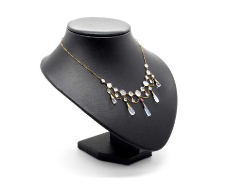 An Antique Arts &amp; Crafts Style Moonstone and Ruby Festoon Necklace, the alternate graduated cabochon stones collet set to