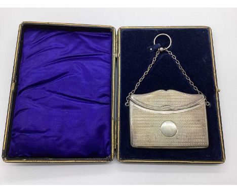 A Hallmarked Silver Card Case, Henry Matthews, Birmingham 1910, of shaped rectangular form allover engine turned decoration, 