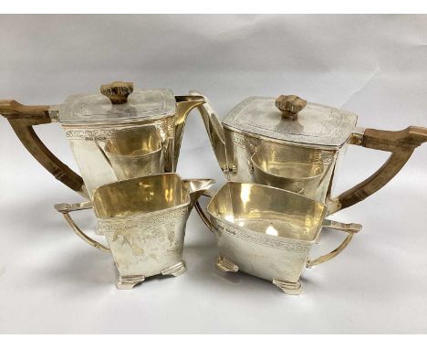 Stower &amp; Wragg; A Hallmarked Silver Four Piece Art Deco Teaset, Sheffield 1938, each of shaped angular form with ornately