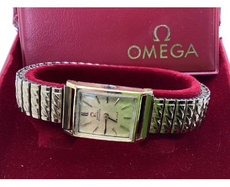 Omega; DeVille Vintage Wristwatch, the signed champagne dial with gilted baton markers, in a plain rectangular case (winder m