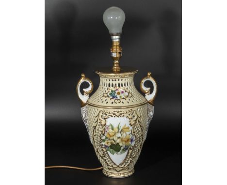 A reticulated lamp with floral decoration  30cm tall